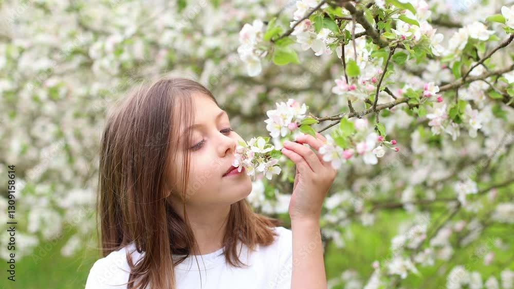 In this enchanting video, a young girl revels in the delightful scents of blooming apple trees in a vibrant spring orchard. In this enchanting video, a young girl revels in the delightful scents of blooming apple trees in a vibrant spring orchard.