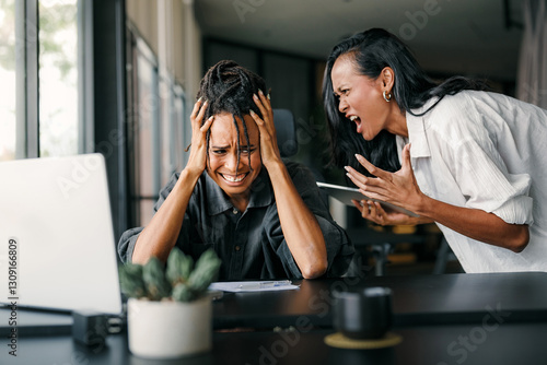 Fotografie Boss shouting at frustrated worker, bullying and emotional abuse at work