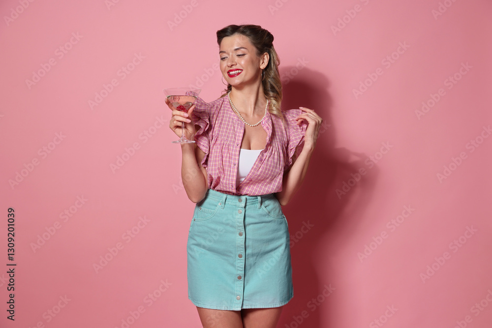 Happy pin-up woman with cocktail on pink background Happy pin-up woman with cocktail on pink background