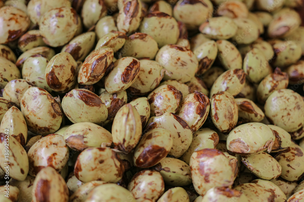 Photo of a pile of yellowish jengkol or archidendron pauciflorum skin taken from a high angle from close range