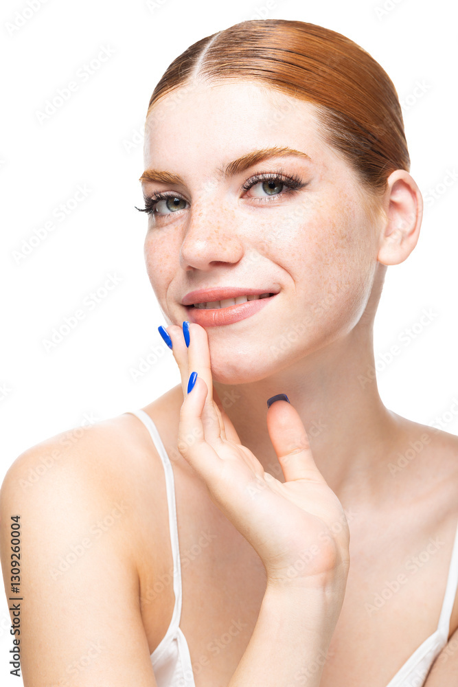A young girl with red hair with freckles in a white top. Beauty portrait of a woman on a white background in the studio. A young girl with red hair with freckles in a white top. Beauty portrait of a woman on a white background in the studio.