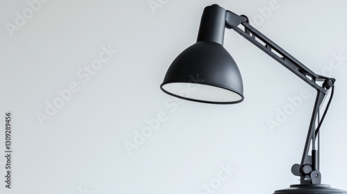 Modern Desk Lamp Against White Wall photo