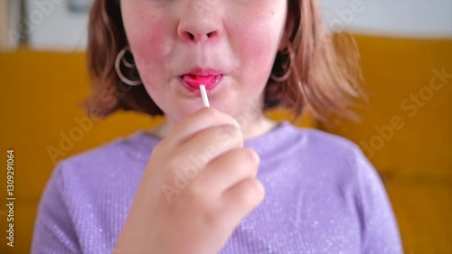 Sweet moments of childhood delight with a heart shaped lollipop
