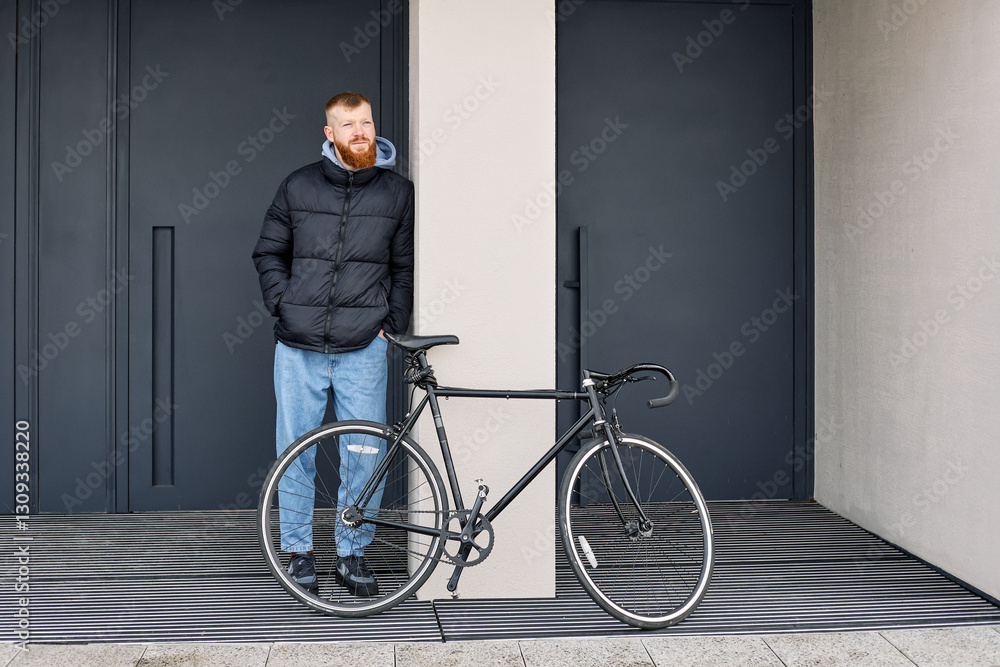 A 30-year-old European man with a red beard rented a bicycle to ride around the city A 30-year-old European man with a red beard rented a bicycle to ride around the city