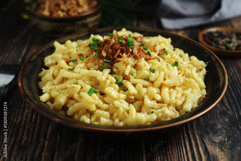Käsespätzle, traditional dish in Germany Käsespätzle, traditional dish in Germany