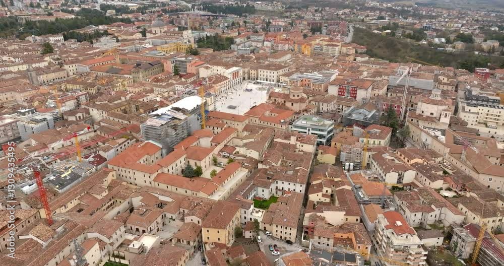 Aerial view of the Piazza del Duomo, also known as Piazza del Mercato. It is the largest and most important square in the historic center of L'Aquila, in Abruzzo, Italy. Aerial view of the Piazza del Duomo, also known as Piazza del Mercato. It is the largest and most important square in the historic center of L'Aquila, in Abruzzo, Italy.