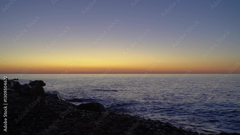 Sunrise over the Black Sea, a beach with cliffs.
Sunset over the Black Sea paints the sky in delicate shades of orange and blue. The waves gently roll over the rocky shore. Sunrise over the Black Sea, a beach with cliffs.
Sunset over the Black Sea paints the sky in delicate shades of orange and blue. The waves gently roll over the rocky shore.