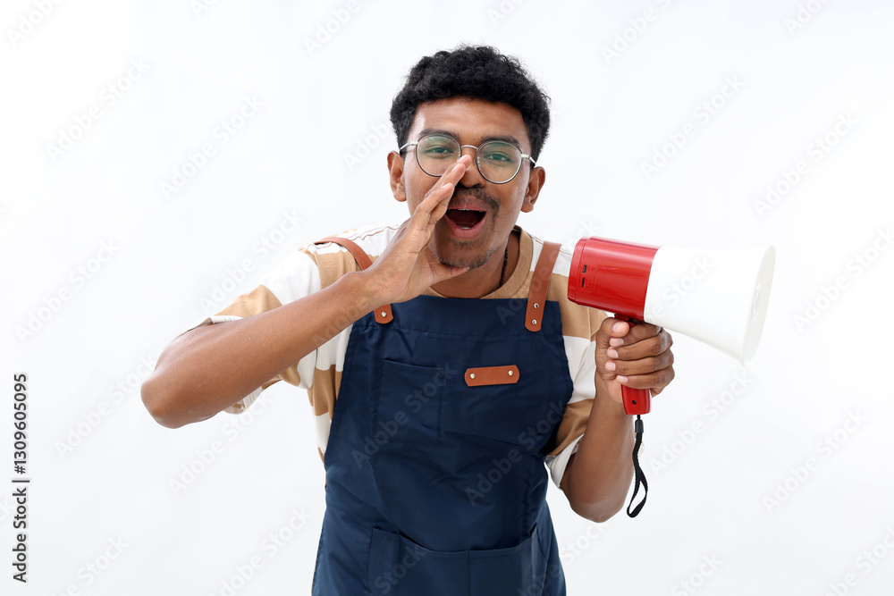 A young asian male barista wearing an apron speaking something using a megaphone making an announcement