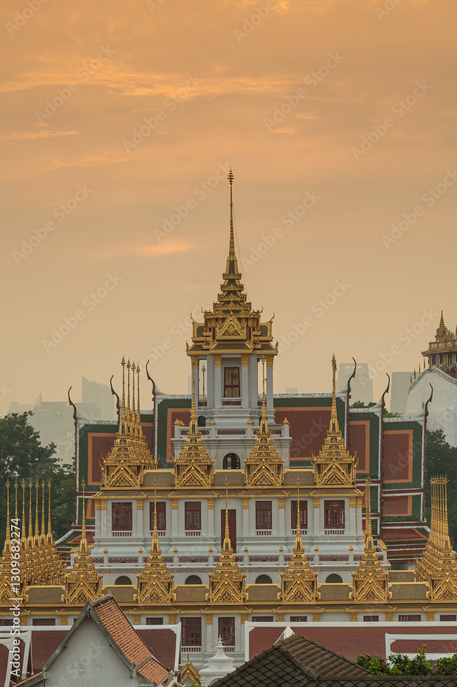 Naklejka premium Wat Ratchanatdaram and Loha Prasat Metal Castle at sunset, landmark and famous place of Bangkok city, Thailand