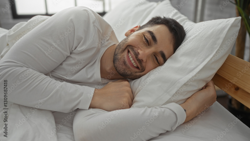 Smiling man relaxing in bed with natural light in cozy bedroom setting, showcasing a peaceful morning indoors. Smiling man relaxing in bed with natural light in cozy bedroom setting, showcasing a peaceful morning indoors.
