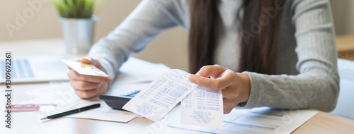 фотографія Business financial concept, stressed asian young business woman hand holding credit card for calculate accounting expense of bill, tax for payment on due deadline, trying to find money to pay debt