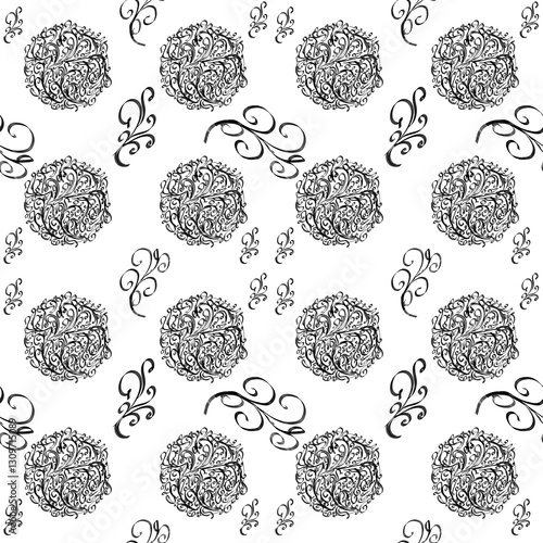 This pattern features intricate black ornamental designs on a white background. It consists of circular floral motifs with detailed swirls and curls, accompanied by elegant, curved decorative elements