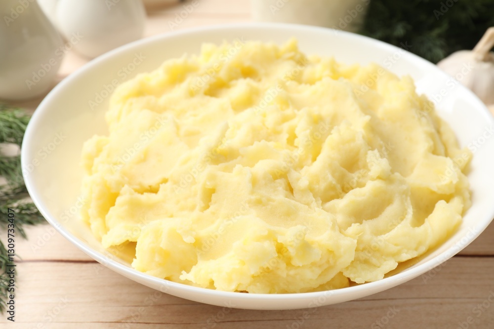 Delicious mashed potato on white wooden table, closeup Delicious mashed potato on white wooden table, closeup