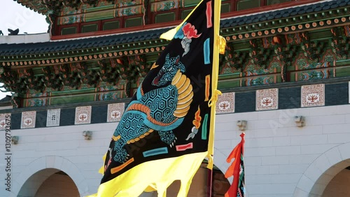 Vibrant flags during the Royal Guard Changing Ceremony at Gyeongbokgung Palace in Seoul, South Korea, showcasing traditional Korean culture and historical reenactments