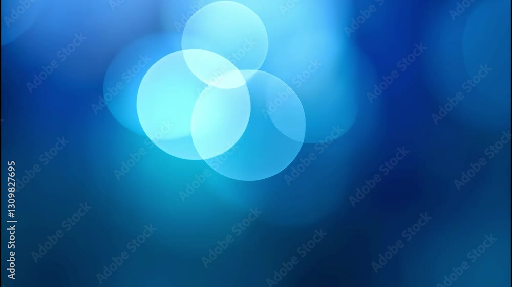 Abstract slow-motion video of glowing blue bokeh circles floating on a smooth gradient background