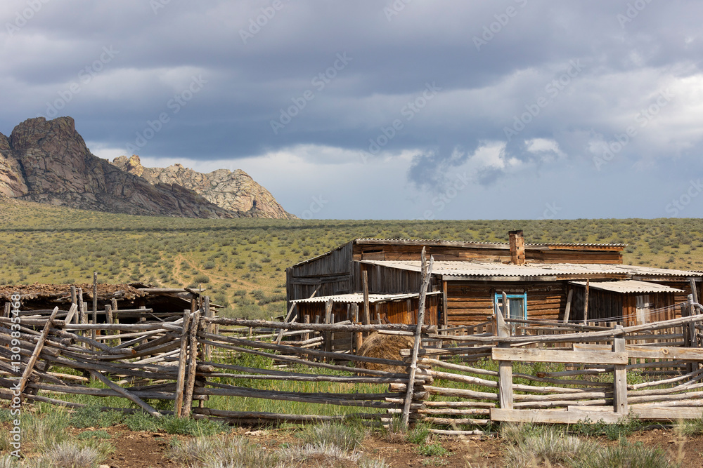 Yurt and old wooden house. Cattlemen's dwelling. Republic of Tyva.Russia