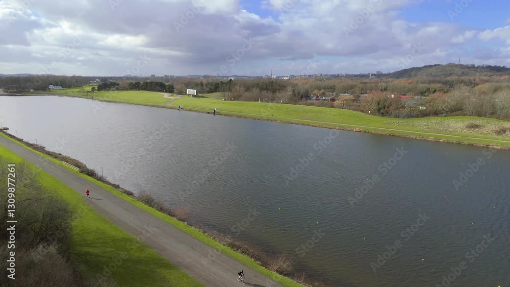 Aerial view drone high above large waterbody lake near Nottingham England for watersports and sailing on a sunny day Aerial view drone high above large waterbody lake near Nottingham England for watersports and sailing on a sunny day