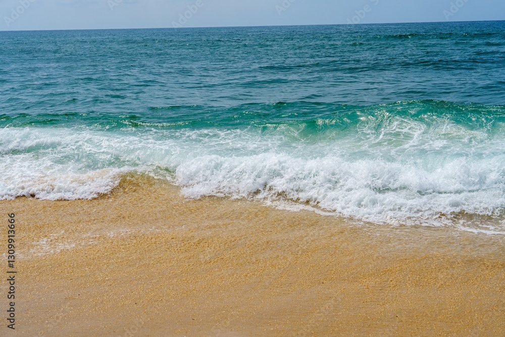 The image beautifully depicts a sandy beach with gentle ocean waves crashing in the background. The soft beige sand contrasts with the deep blue water, creating a serene and inviting atmosphere. The image beautifully depicts a sandy beach with gentle ocean waves crashing in the background. The soft beige sand contrasts with the deep blue water, creating a serene and inviting atmosphere.
