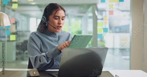 Laptop, tablet and woman receptionist with headset in office with online enquiry for client booking. Computer, tech and female virtual assistant with call for appointment scheduling with company.