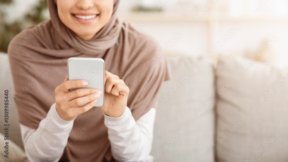 Modern Communication. Closeup Of Unrecognizable Muslim Woman In Hijab Using Smartphone At Home, Browsing Internet Or Texting With Friends, Panorama