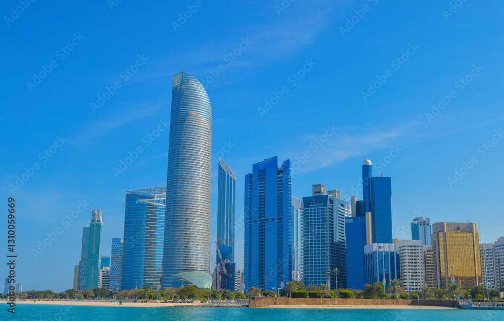 Abu Dhabi capital of UAE skyline along Corniche beach taken from a boat Abu Dhabi capital of UAE skyline along Corniche beach taken from a boat