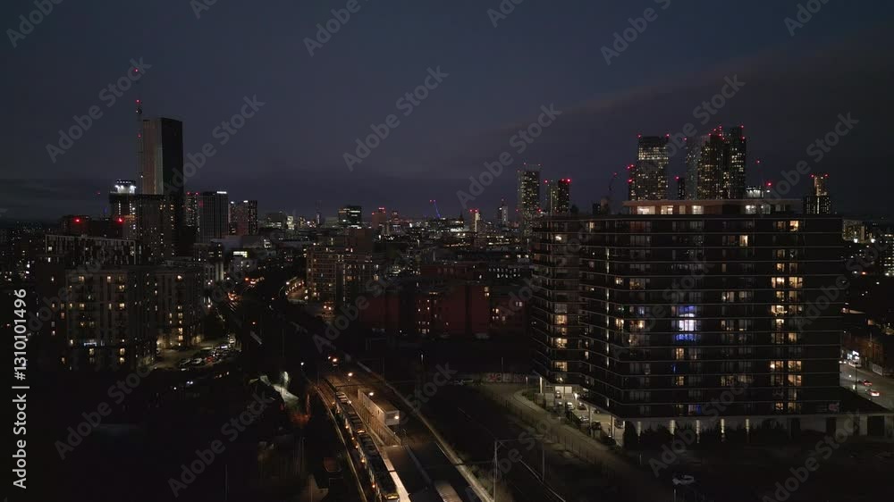 A stunning evening view of Deansgate Square in Manchester, showcasing illuminated urban architecture and transportation. This scene captures the charm of the city transitioning into night. A stunning evening view of Deansgate Square in Manchester, showcasing illuminated urban architecture and transportation. This scene captures the charm of the city transitioning into night.