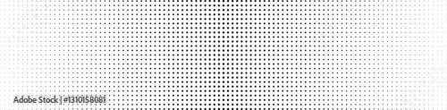 Basic halftones have the effect of black dots and a white background. Abstract monochrome texture, polka dots, large tear in the center, small gradients on the sides, horizontal cover.