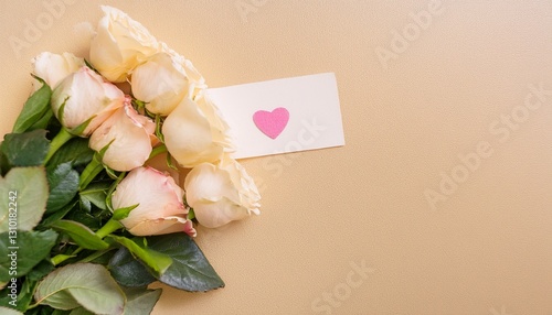 white bouquet of roses with love letter