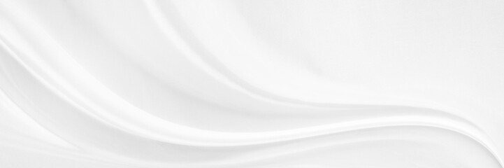 White gray satin texture that is white silver fabric silk background with beautiful soft blur pattern natural.