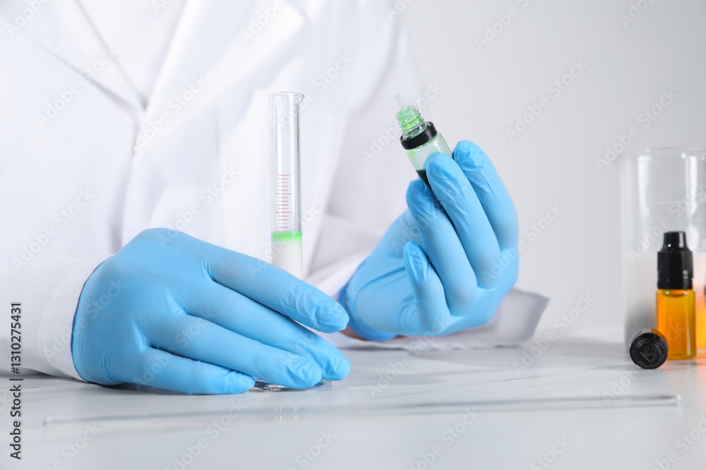 Laboratory testing. Scientist working with test tube at white marble table, closeup Laboratory testing. Scientist working with test tube at white marble table, closeup