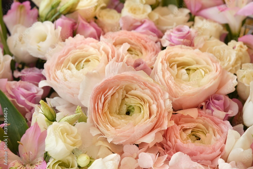 Obraz premium Summer blossoming delicate ranunculus on blooming flowers festive background, pastel and soft bouquet floral card, selective focus, shallow DOF