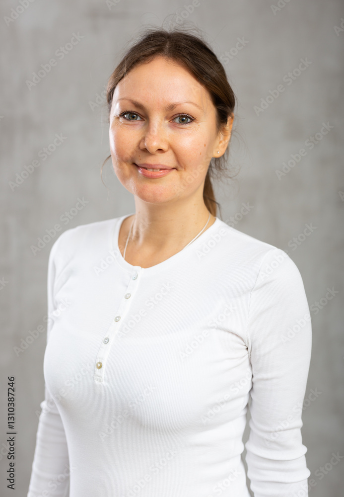 Portrait of smiling adult woman in casual clothes in studio Portrait of smiling adult woman in casual clothes in studio