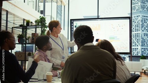 Executive board members meeting in conference room to establish future growth plan, ensuring expansion goals for the multinational company. Big data insights to make informed decisions. Camera B.