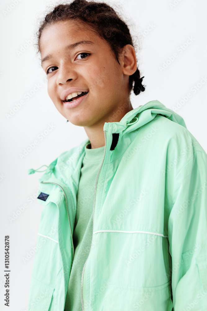 Stylish young boy in green jacket and black tshirt with trendy design Stylish young boy in green jacket and black tshirt with trendy design