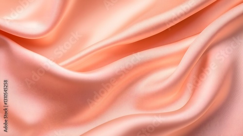 Soft peach satin fabric with flowing folds and a silky sheen. The smooth and luxurious texture creates an elegant and sophisticated aesthetic, perfect for fashion and interior design.