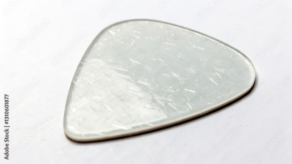 White Guitar Pick on White Background White Guitar Pick on White Background