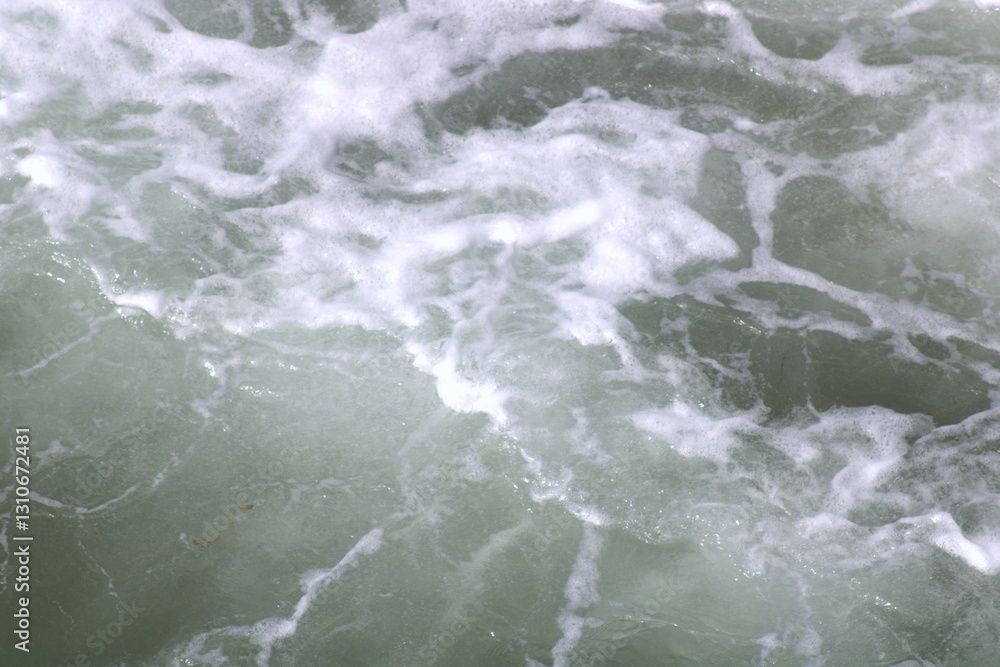 Fototapeta premium white frothy up close ocean waves