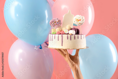 Hand holding birthday cake ...