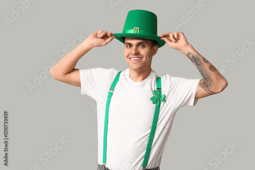 Happy tattooed young man in...