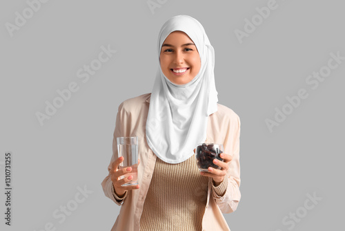 Young Muslim woman with dat...