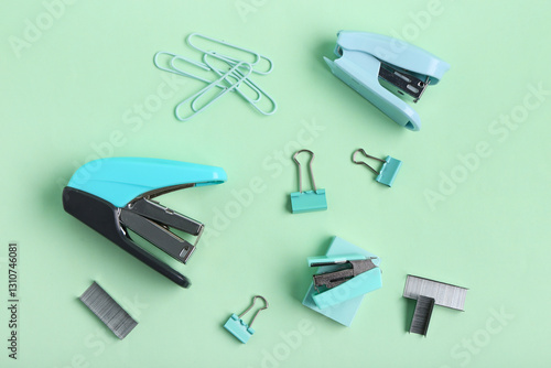 Blue staplers with clips an...