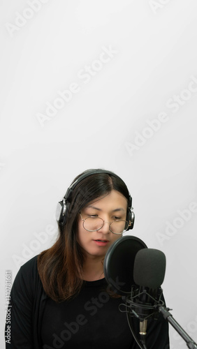 Woman (LGBTQ) singer sing a song with microphone photo