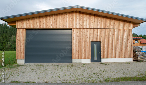 New modern rolling garage doors. Automatic gray roller shutter entrance door of an industrial warehouse.