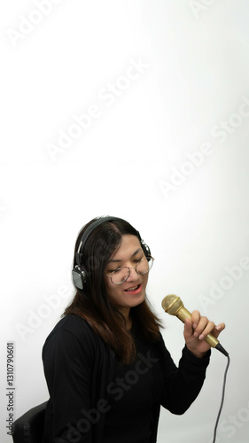 Woman (LGBTQ) singer sing a song with microphone photo