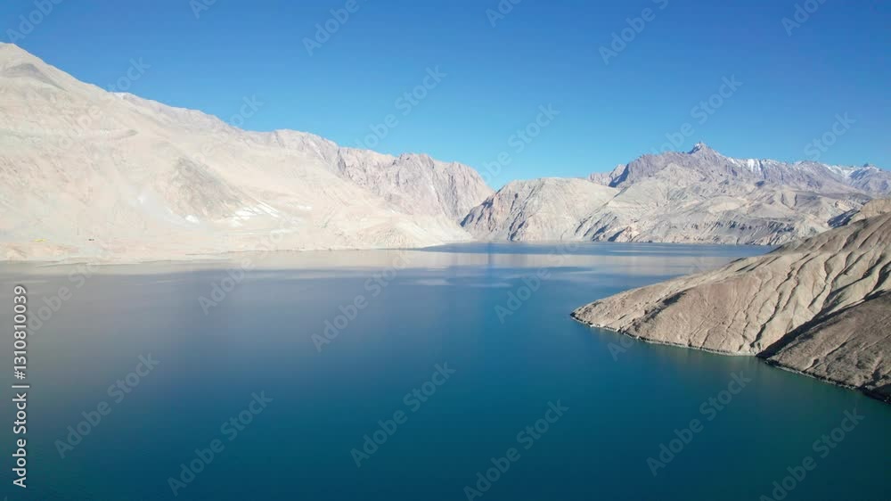 Drone view of Bulungkol or Bandier blue Lake on sunny day in Tashkurgan County, Kashgar, Southern Xinjiang, China. Aerial landscape of landmark on Pamir plateau, 4k real time footage, travel concept. Drone view of Bulungkol or Bandier blue Lake on sunny day in Tashkurgan County, Kashgar, Southern Xinjiang, China. Aerial landscape of landmark on Pamir plateau, 4k real time footage, travel concept.