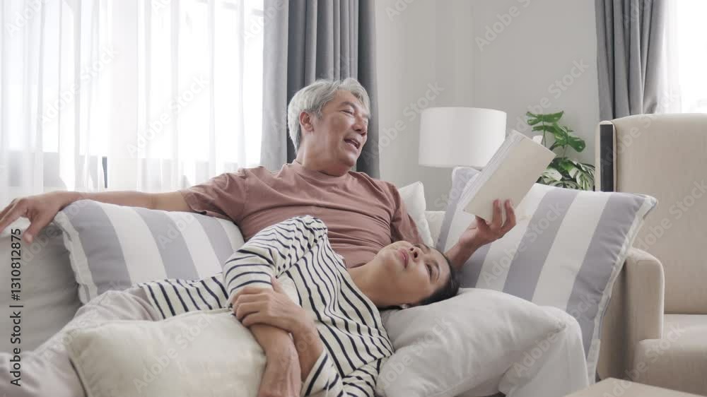 Senoir Asian couple reading book and relax at home Senoir Asian couple reading book and relax at home