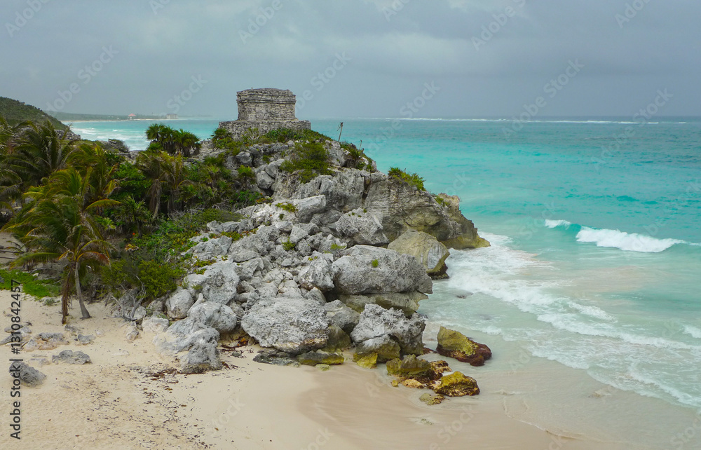 Ancient Mayan Ruins over the turquoise waters off the coast of Mexico near Tulum and Cancun