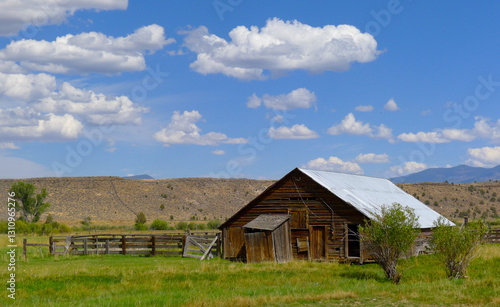 Pastoral decrepit barn on a rural road under the clouds in Northern California