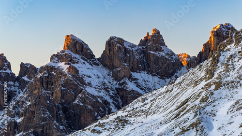 Wallpaper Mural the illuminated peaks of snow-capped mountains in Italy. Dolomites in winter at sunset. Italian mountains under snow lit by the sun. Rocky mountains. Winter in the Dolomites Torontodigital.ca