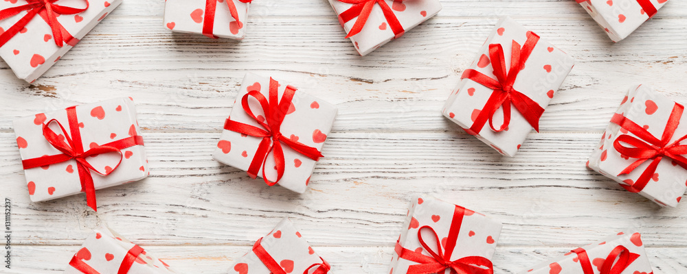 Valentine day composition Background: red gift box with bow and heart. Christmas present. View from above. Holday greeting card Valentine day composition Background: red gift box with bow and heart. Christmas present. View from above. Holday greeting card